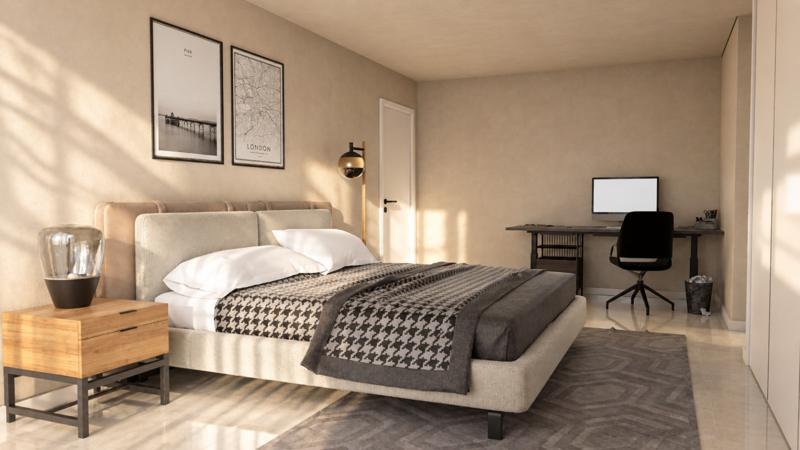 Quarto com zona de trabalho junto à janela